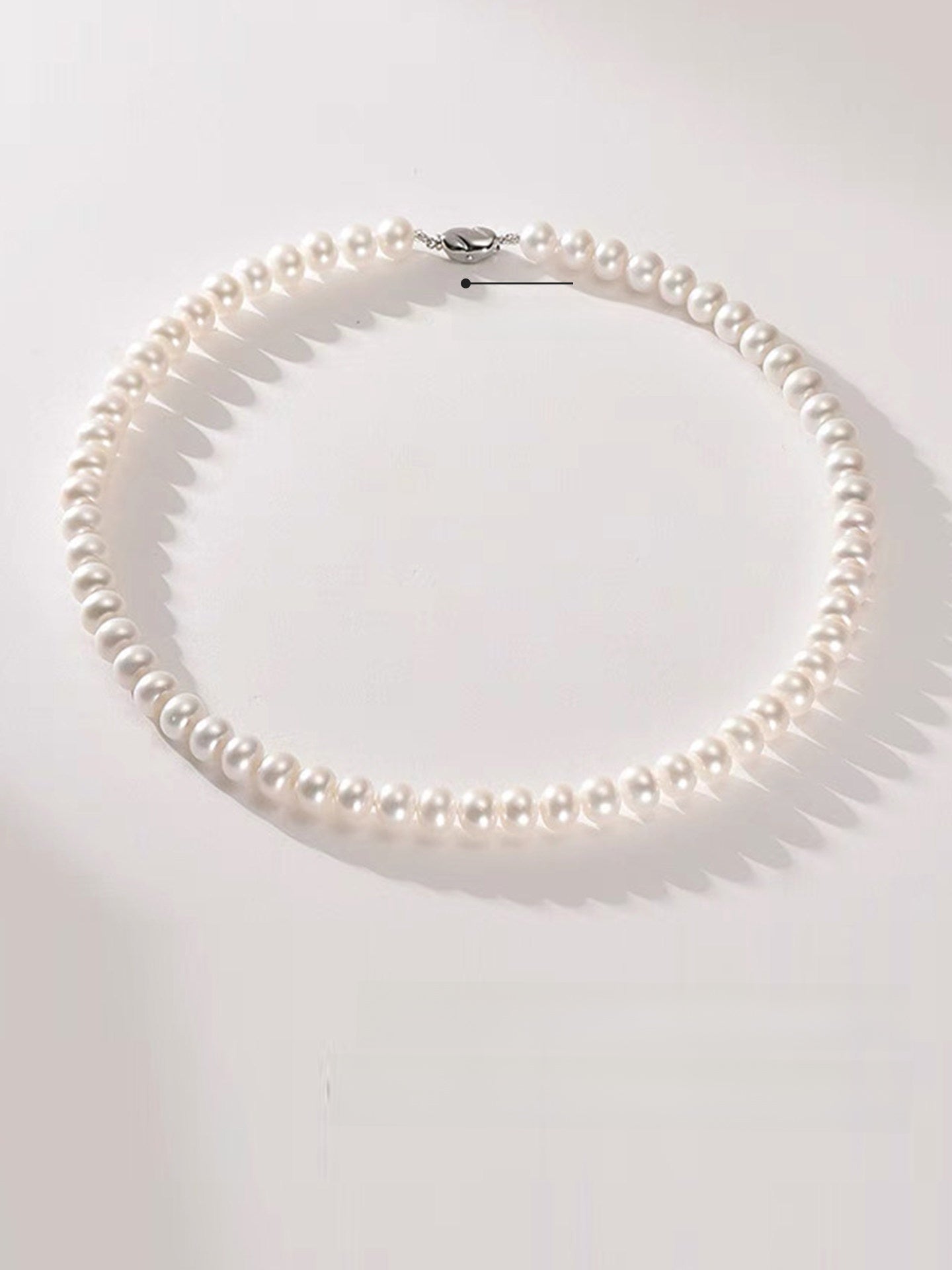 Pearl necklace on a white background