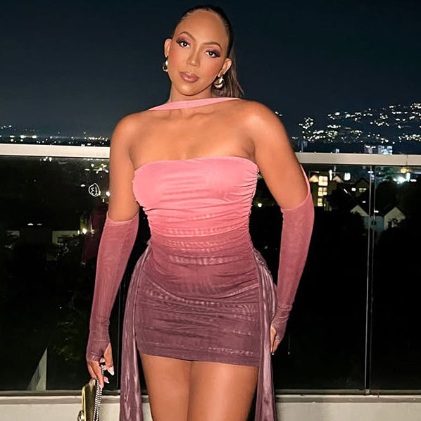 Woman in a pink dress with a cityscape in the background