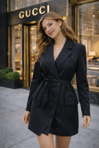 Woman in a black outfit standing in front of a Gucci store