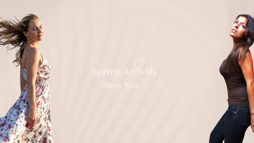 Two women in casual clothing with 'Spring Arrivals Shop Now' text on a plain background
