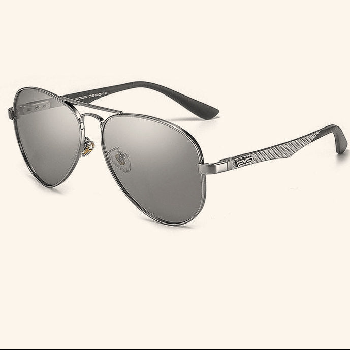 Sunglasses with reflective lenses and black frames on a white background, featuring the brand 'Caponi'.